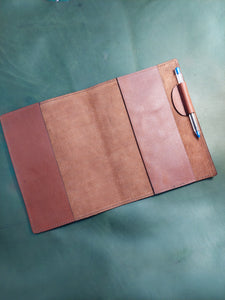 Book cover with pen holder